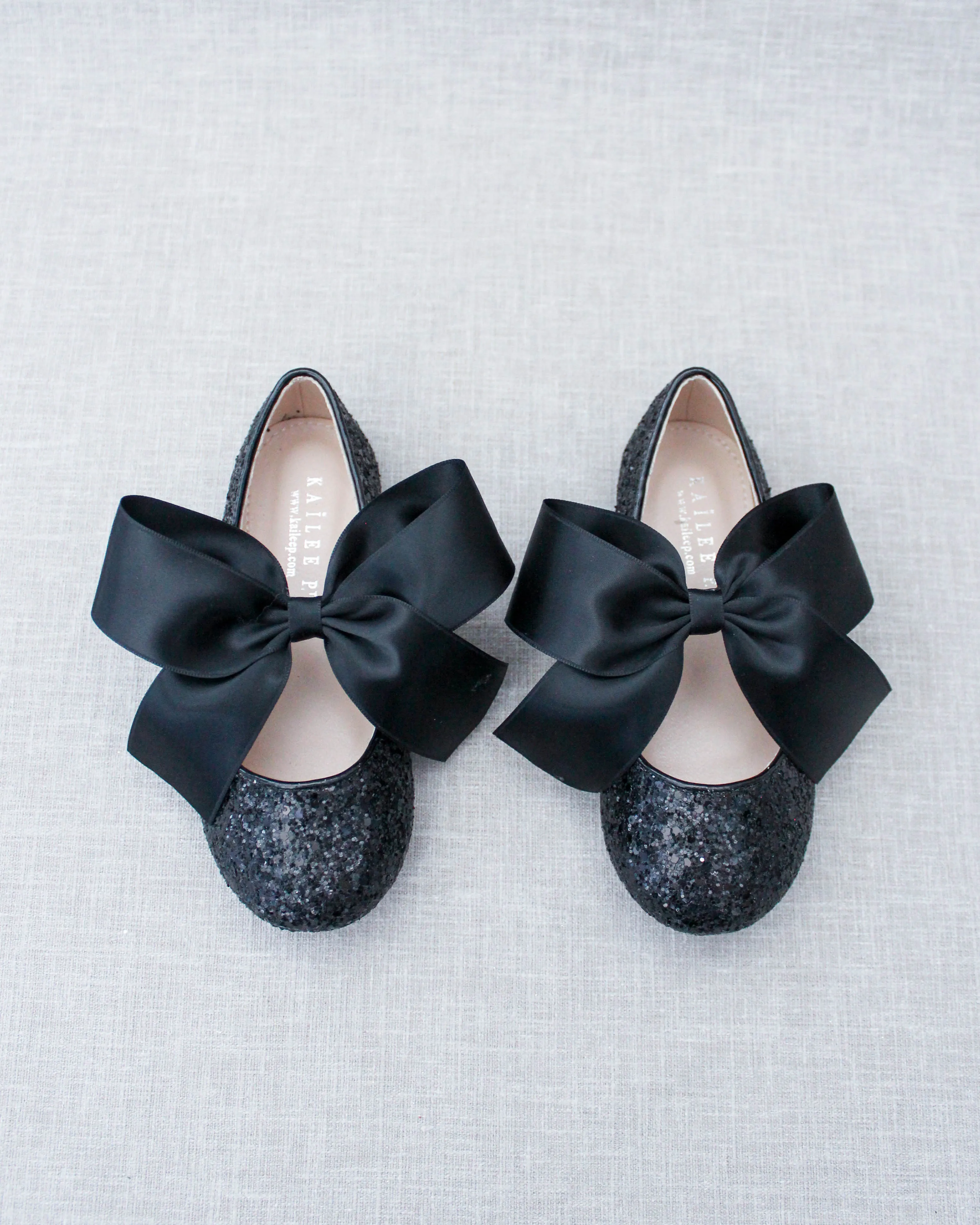 Black Satin Bow Ballet Flats with Sparkly Black Rock Design