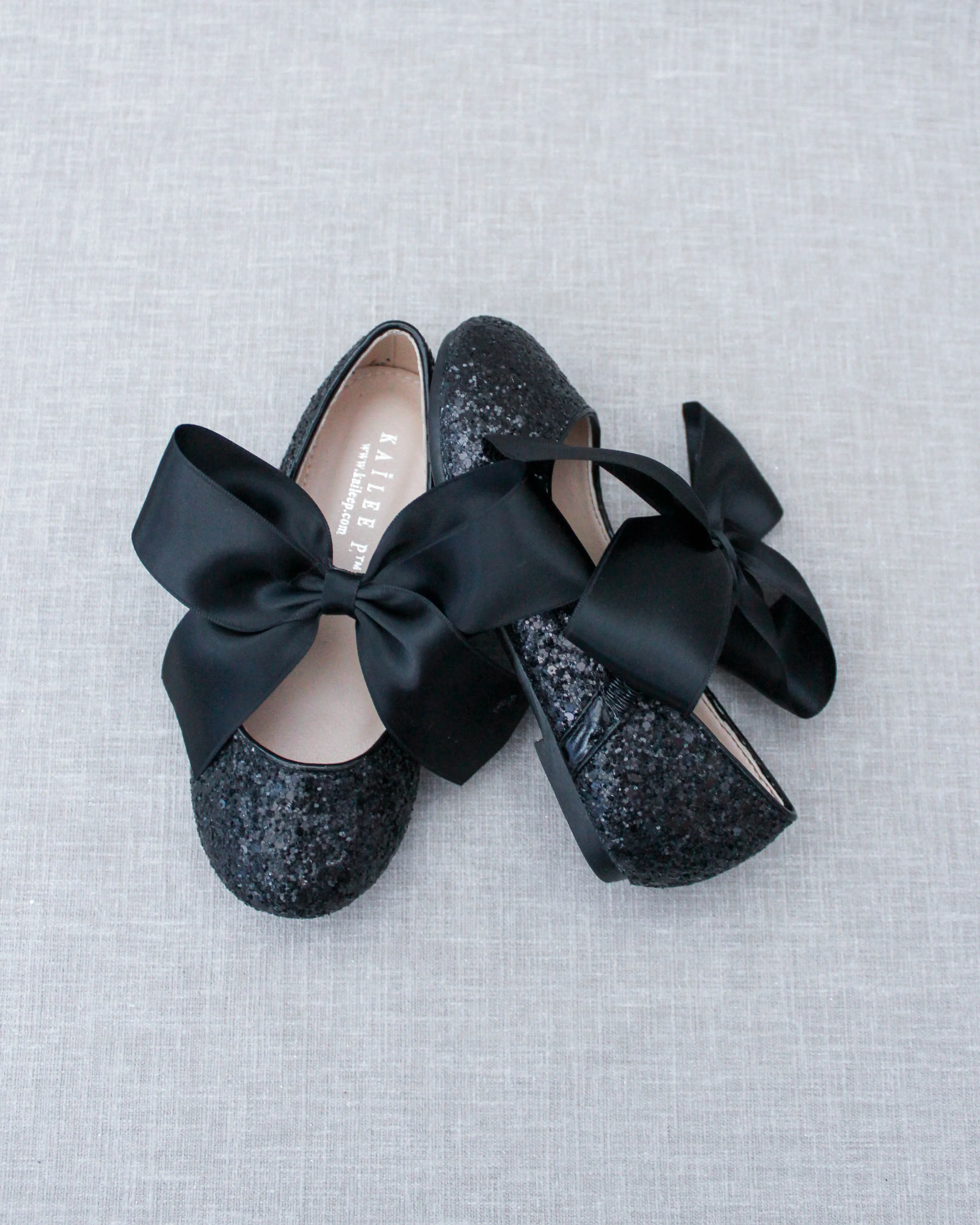 Black Satin Bow Ballet Flats with Sparkly Black Rock Design