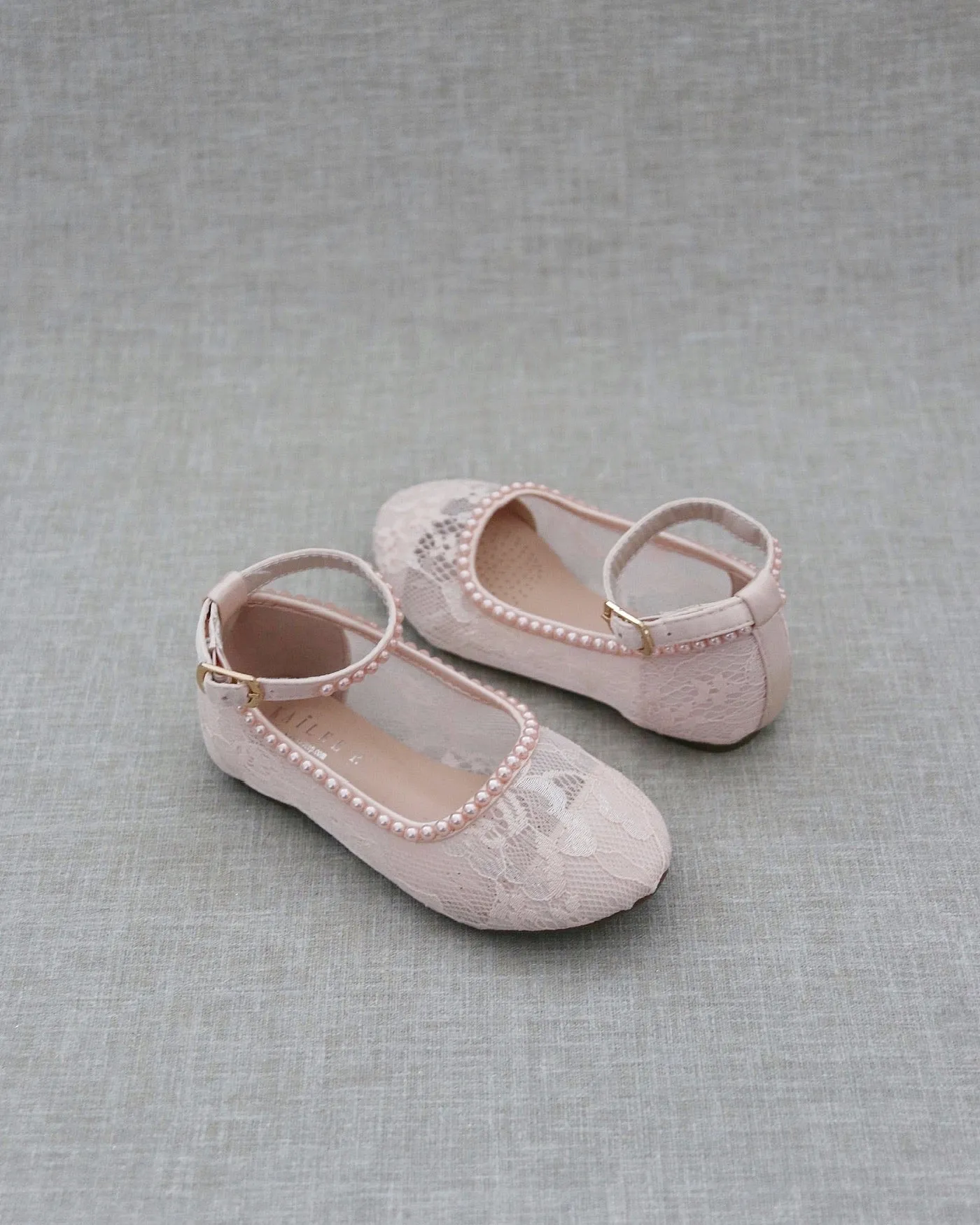 Pink lace ballet flats with mini pearls.