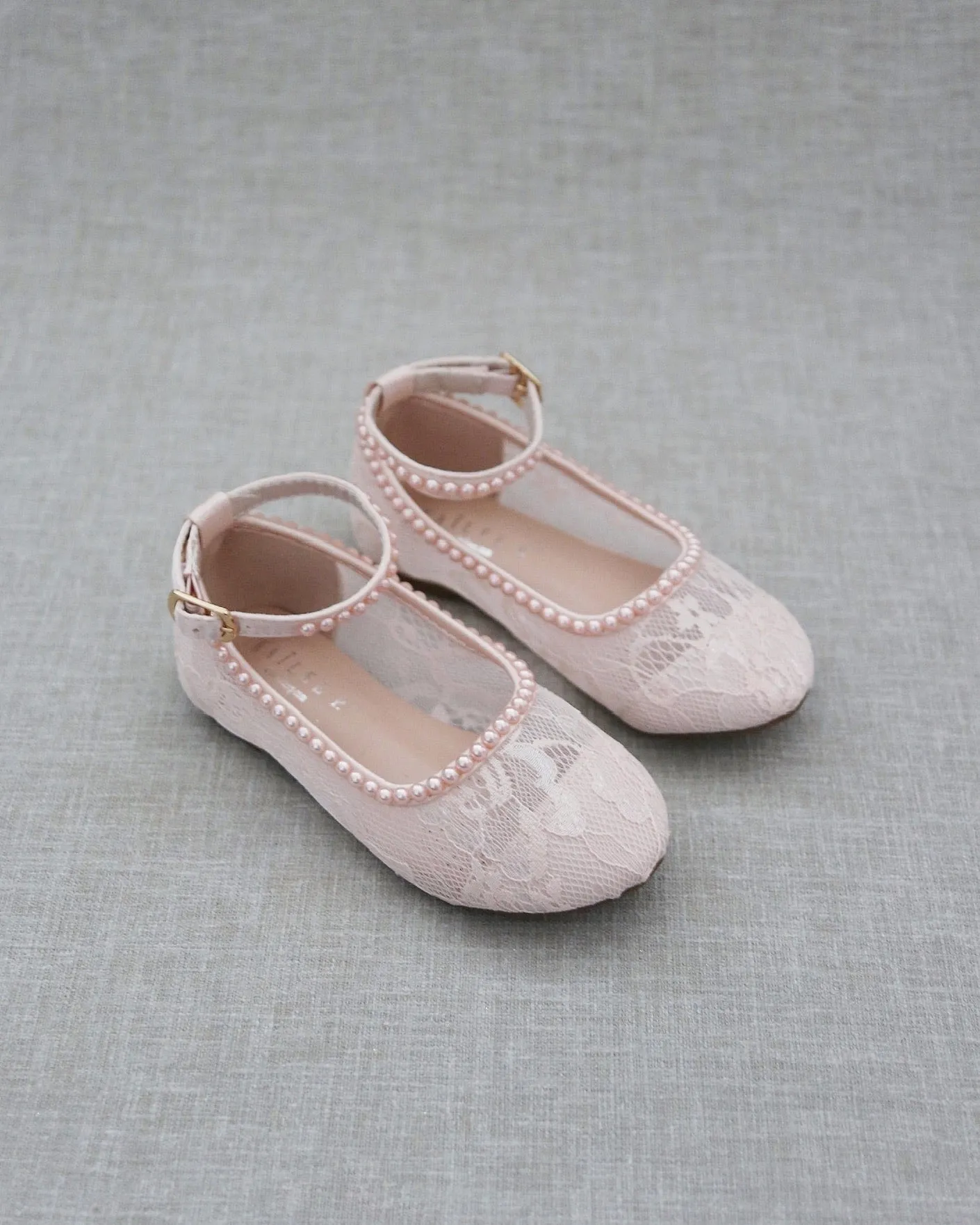 Pink lace ballet flats with mini pearls.