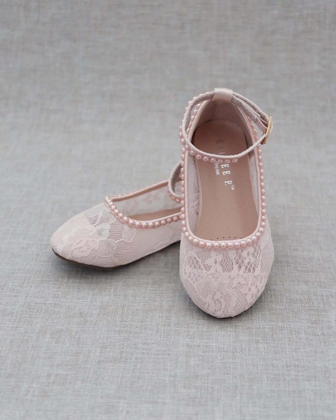 Pink lace ballet flats with mini pearls.