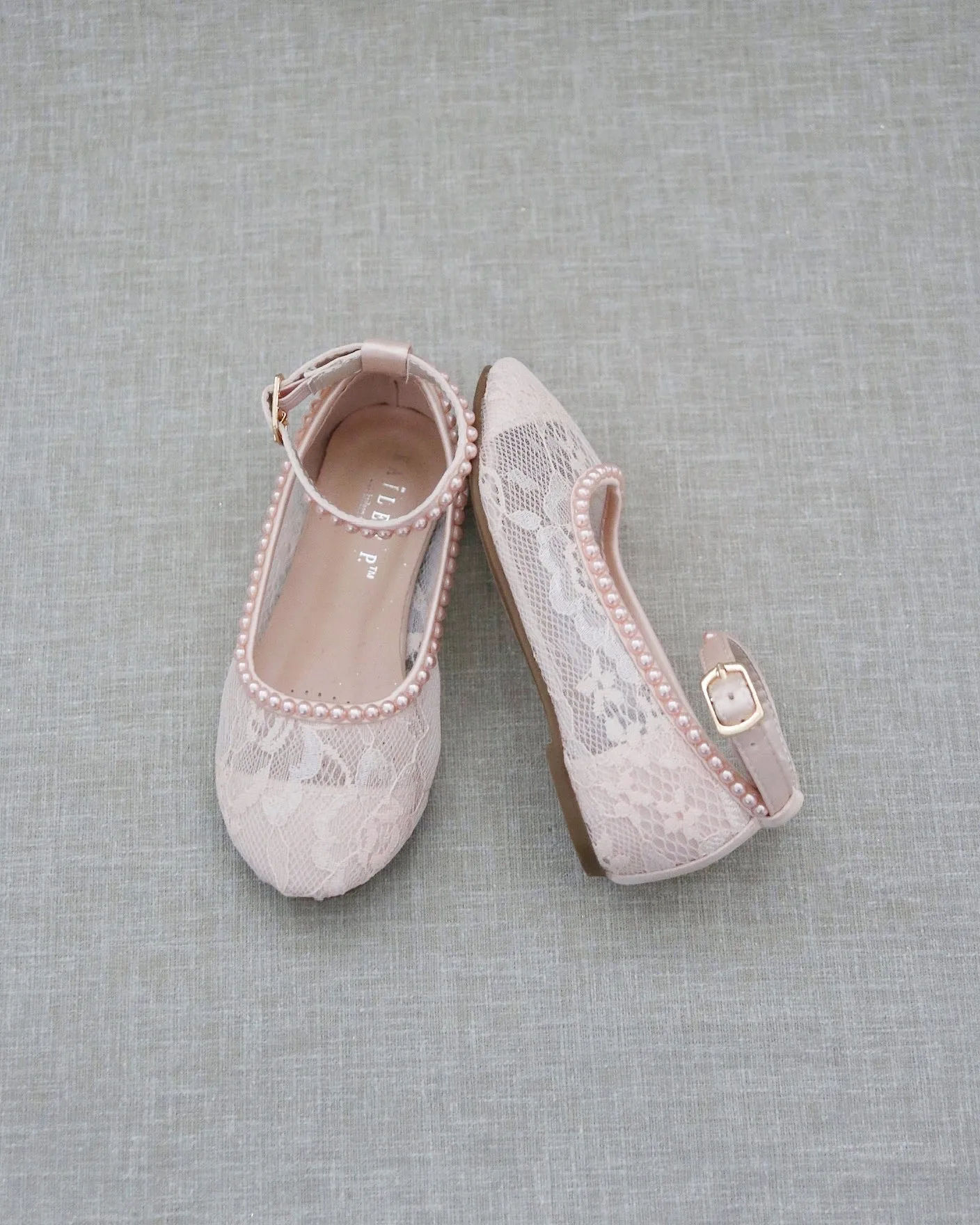 Pink lace ballet flats with mini pearls.