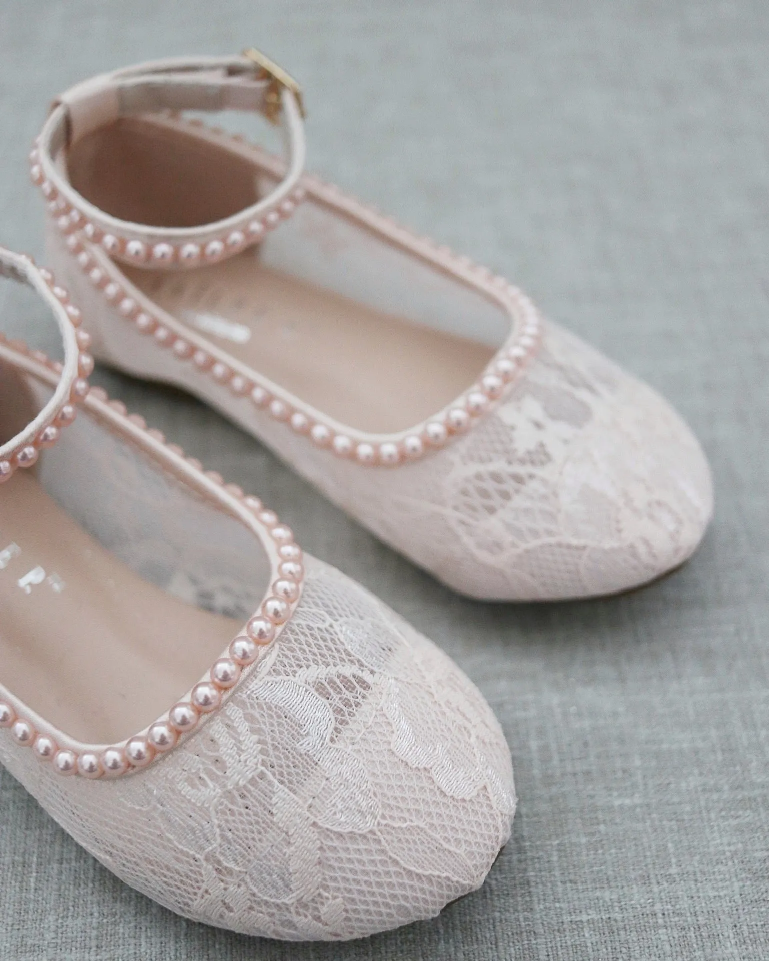 Pink lace ballet flats with mini pearls.