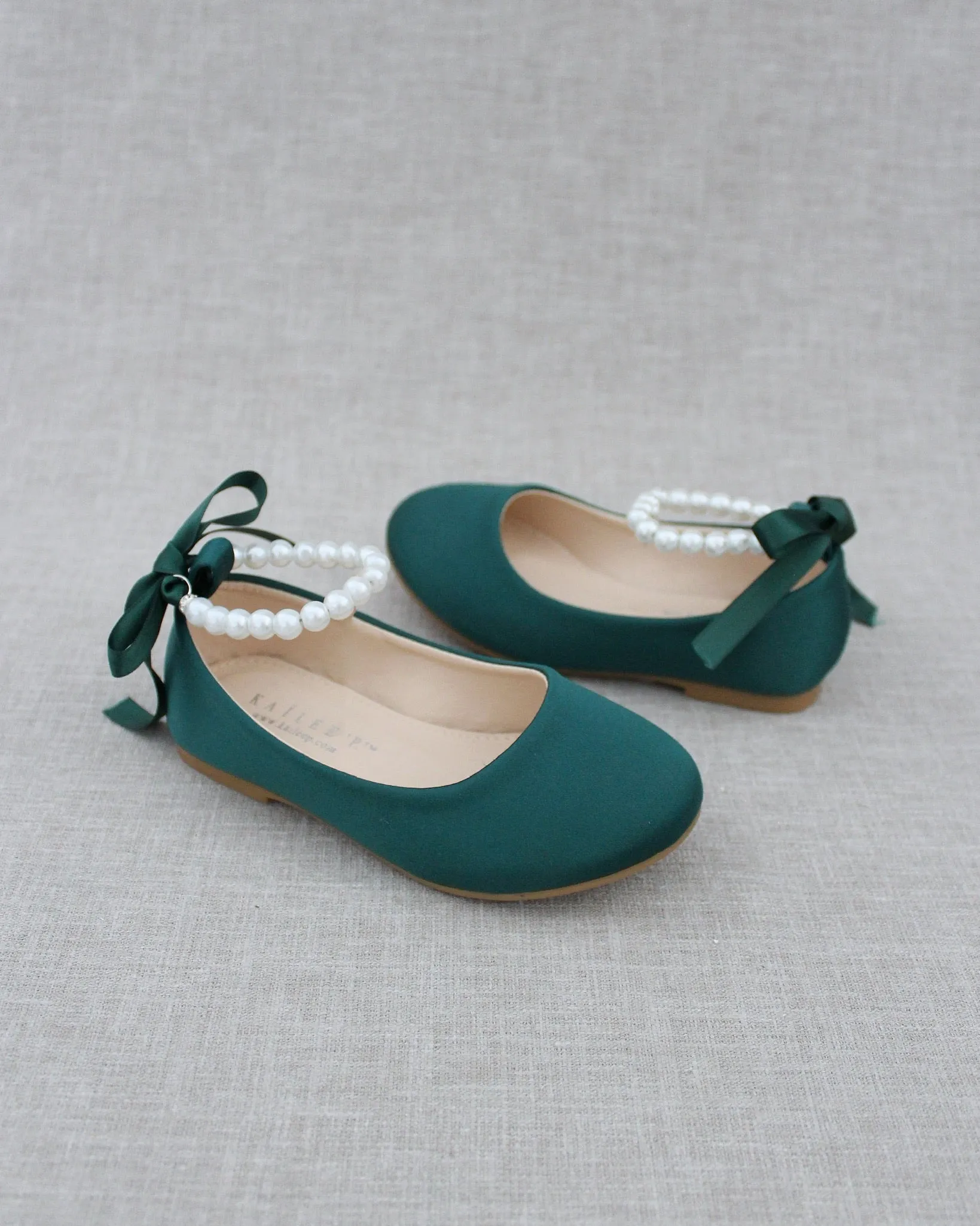 The result is: Satin Flats in Hunter Green with Pearl Ankle Straps